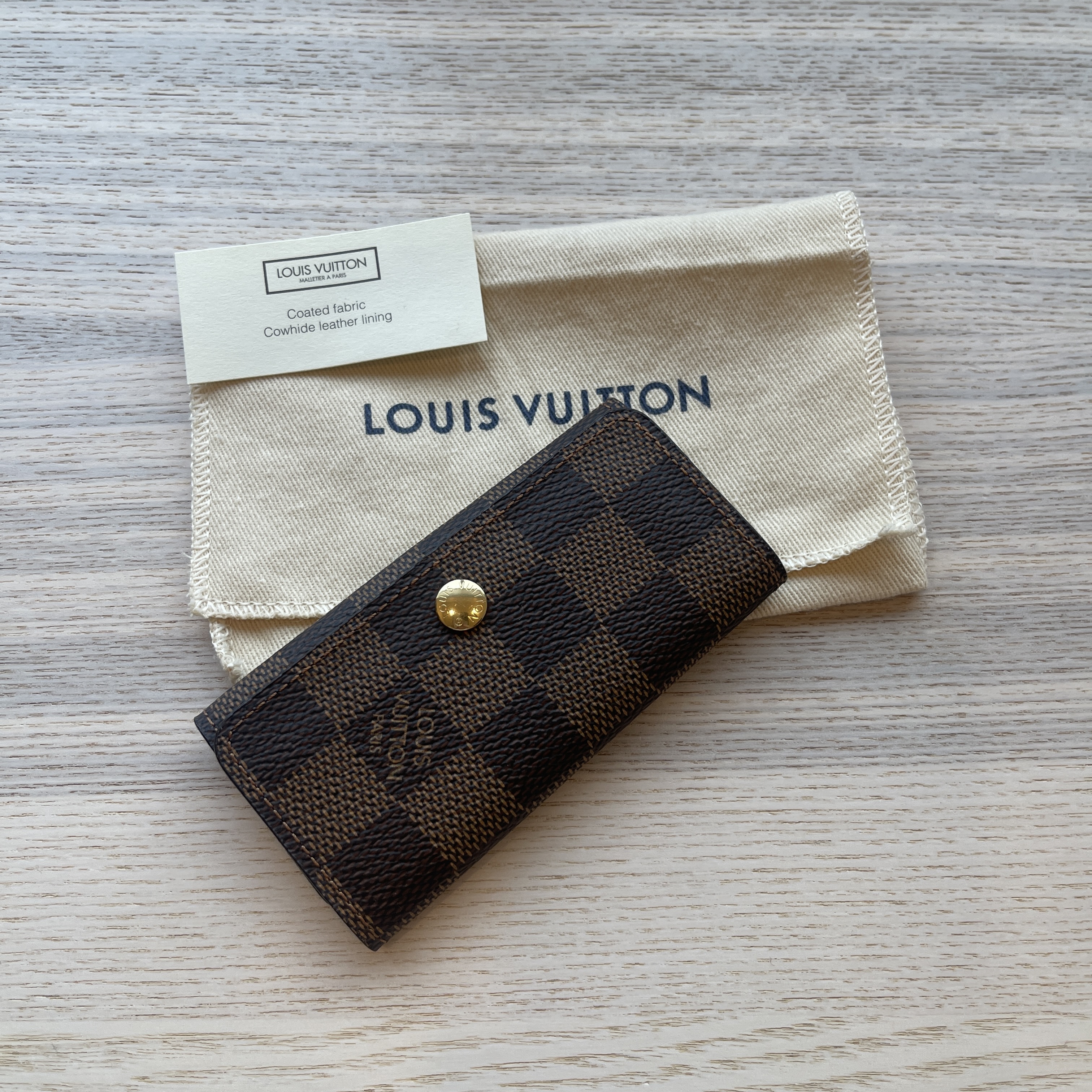 Louis Vuitton Key Holder Multicles 4 Damier Ebene Brown in Canvas with  Gold-tone - US