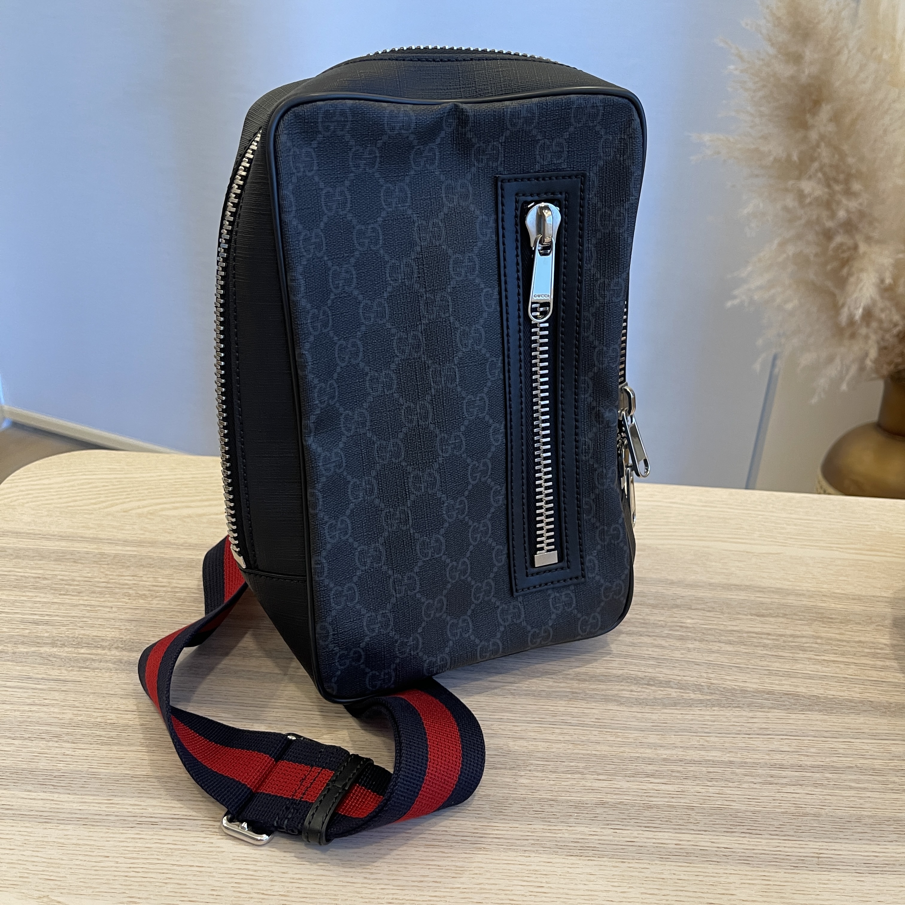 GG Black sling backpack