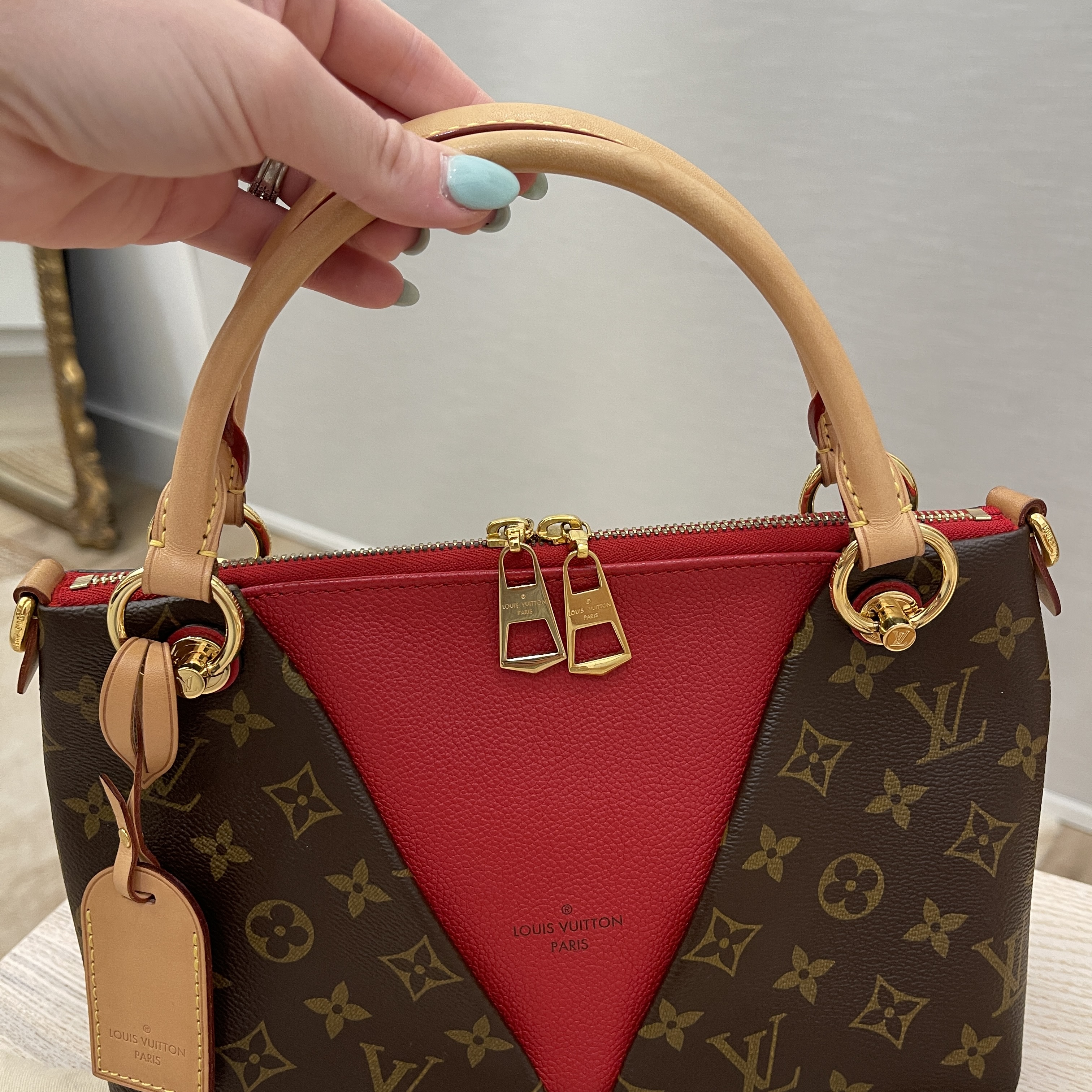 red and brown louis vuitton purse