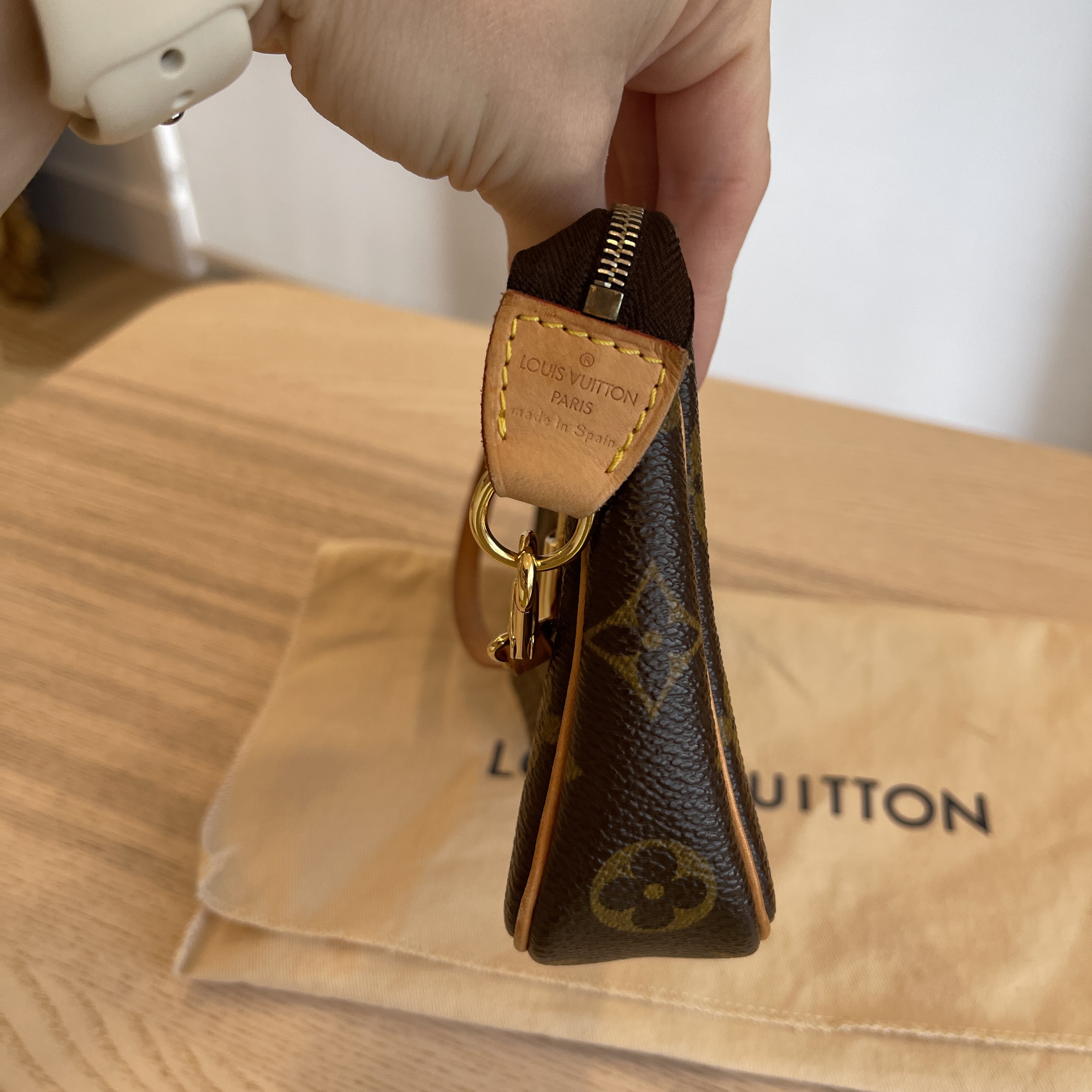 Louis Vuitton Pochette Perforated Padlock - Designer WishBags