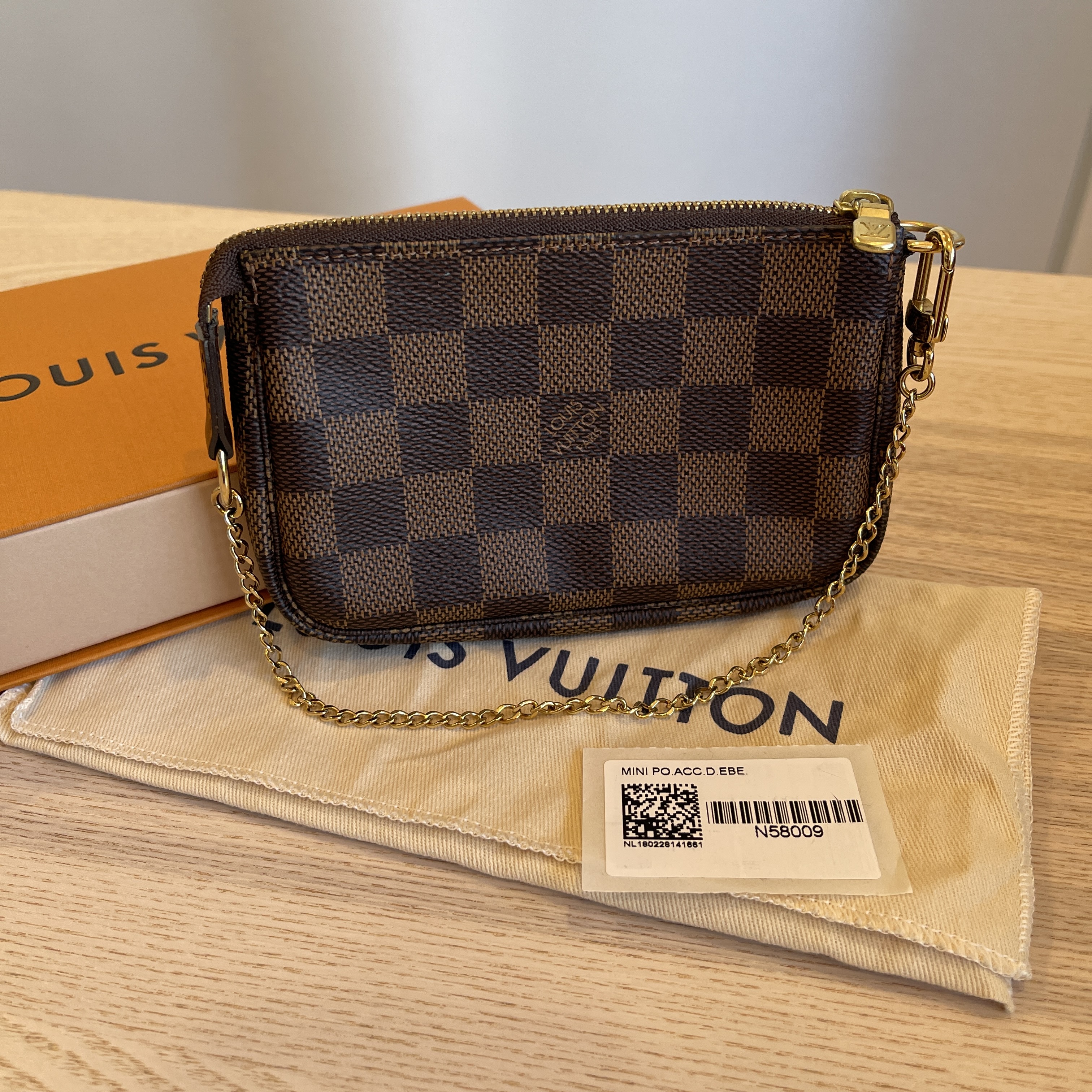 Authentic Louis Vuitton DAMIER EBENE Mini Pochette Accessoires N58009