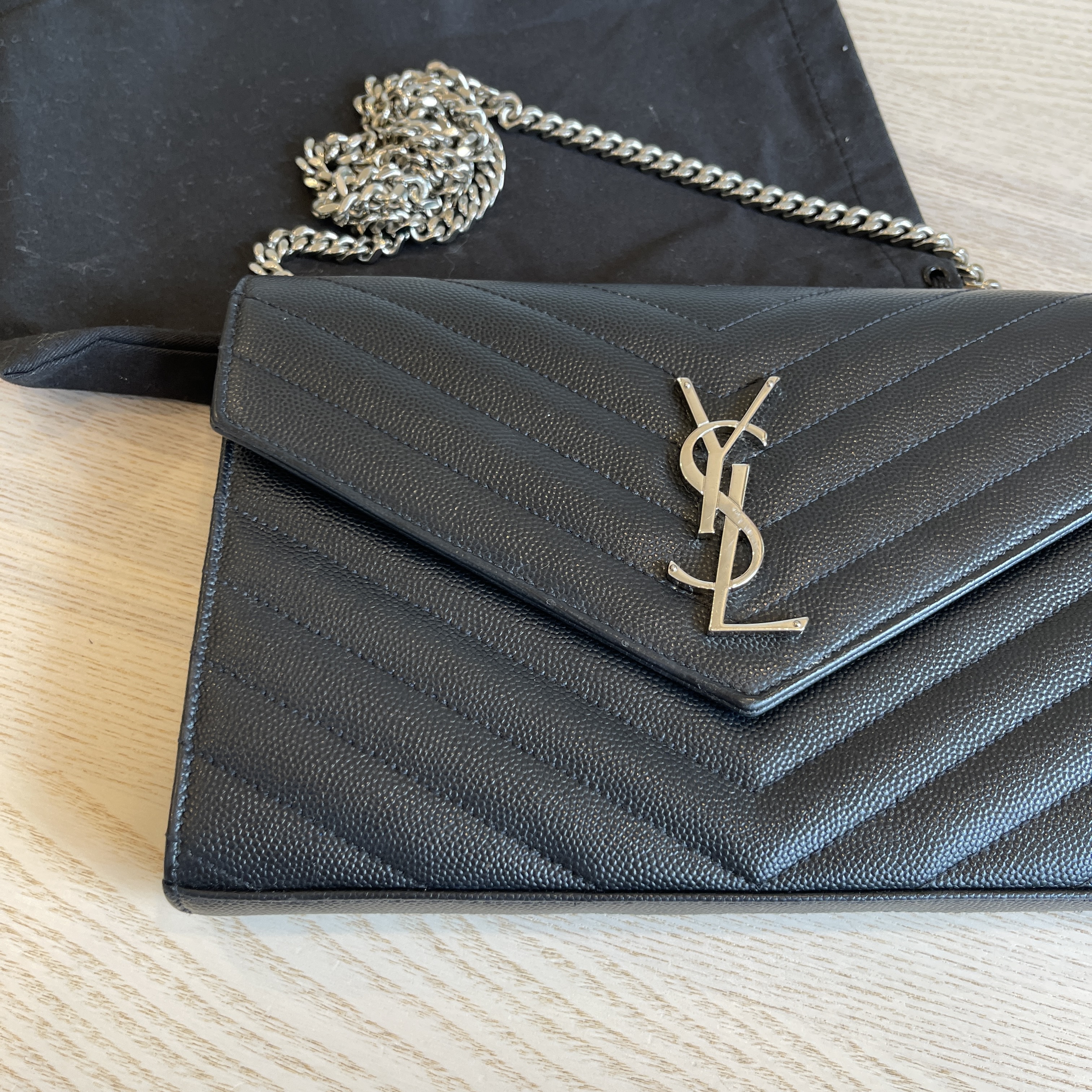 SAINT LAURENT Black envelope wallet with silver monogram