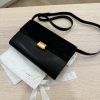 The Row Laurie Clutch in Lux Calfskin and Nubuck Black