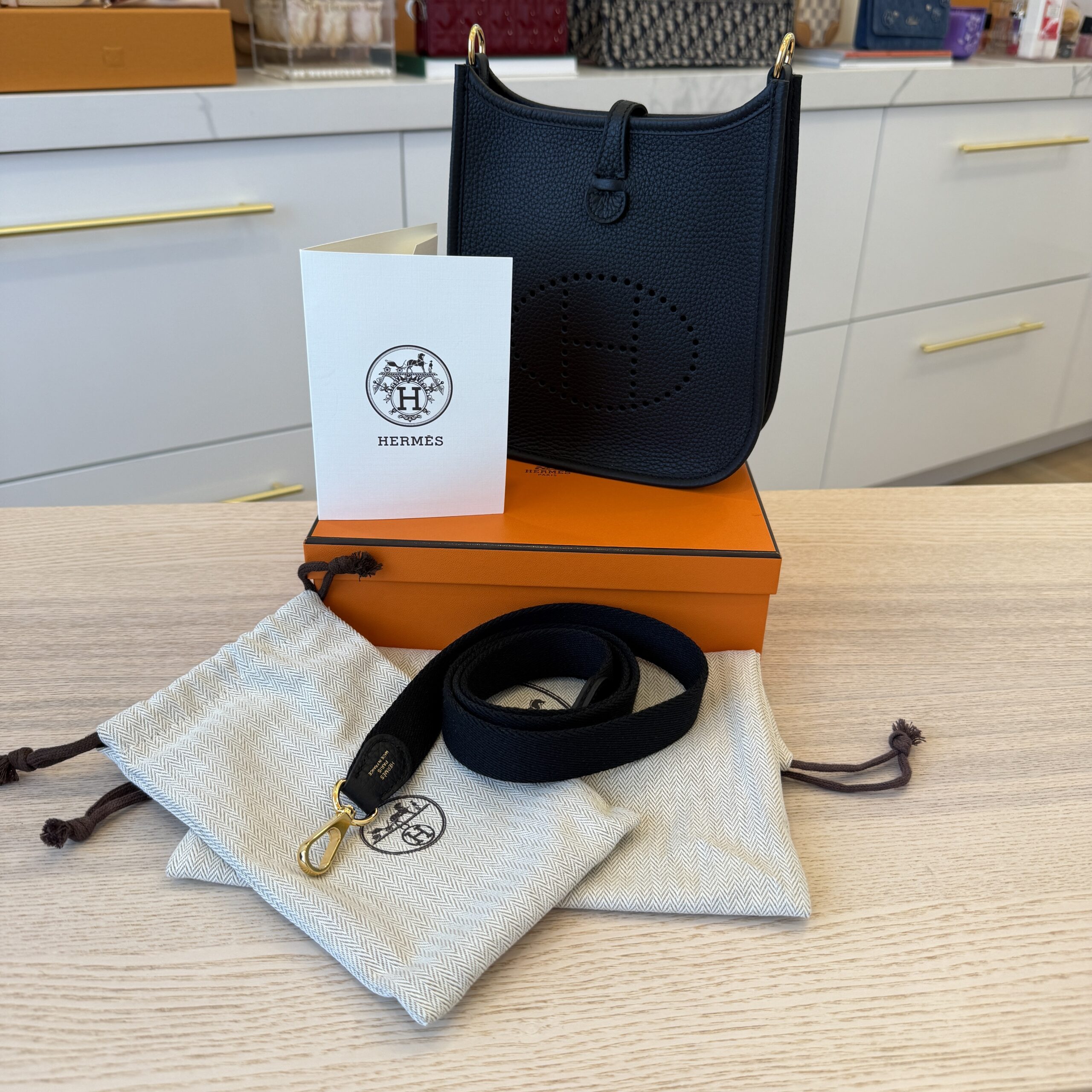 Hermes Taurillon Clemence Evelyne TPM Noir with Gold Hardware