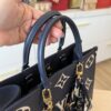 Louis Vuitton Empreinte Monogram Giant Onthego MM Navy and Creme and Silk Braided Bag Charm Multicolor