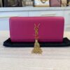 Saint Laurent (YSL) Pink Leather Cassandre Tassel Clutch Bag