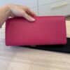 Saint Laurent (YSL) Pink Leather Cassandre Tassel Clutch Bag