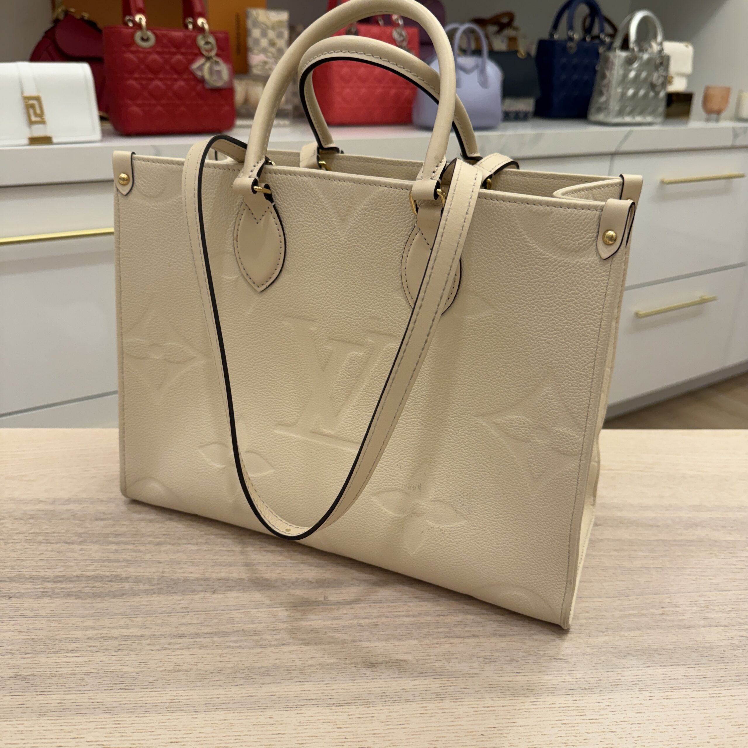 Louis Vuitton Empreinte Monogram Giant Onthego MM Creme